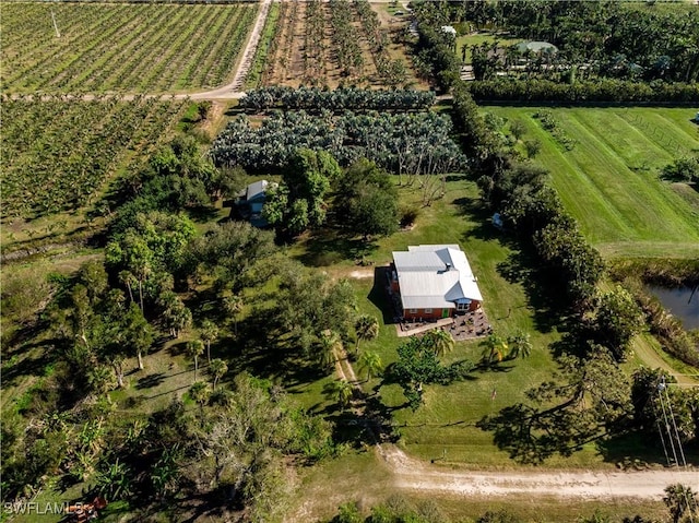 birds eye view of property with a rural view