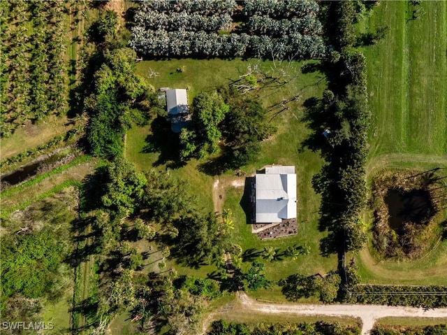 birds eye view of property with a rural view