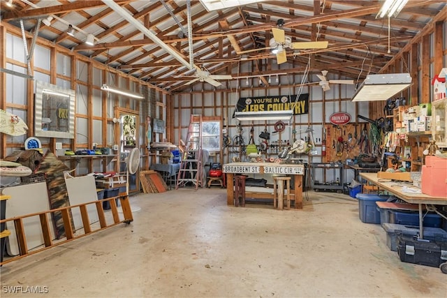 garage with a workshop area and ceiling fan