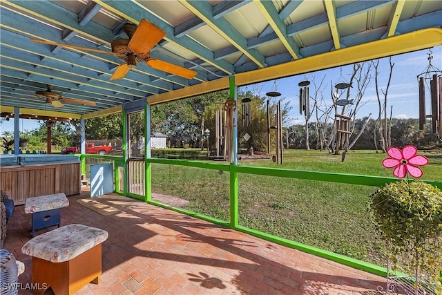 sunroom featuring ceiling fan