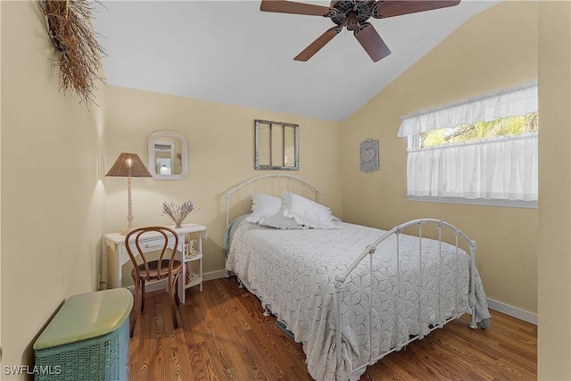 bedroom featuring hardwood / wood-style floors, ceiling fan, and lofted ceiling