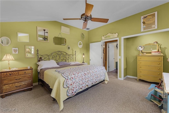 carpeted bedroom with vaulted ceiling and ceiling fan