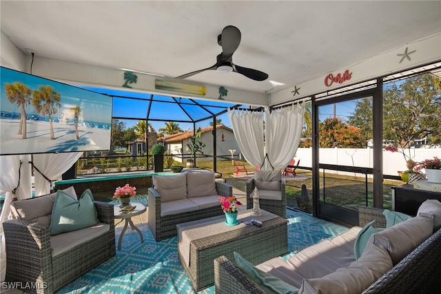 sunroom with ceiling fan