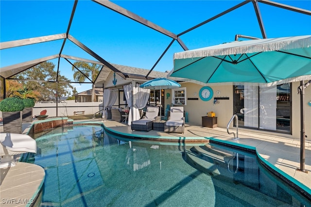 view of pool with a lanai and a patio area