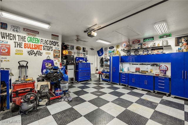 garage with a garage door opener and ceiling fan