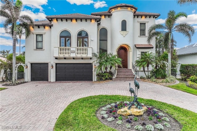 280 Egret Ave, Naples, FL 34108 - mediterranean / spanish-style home featuring a garage