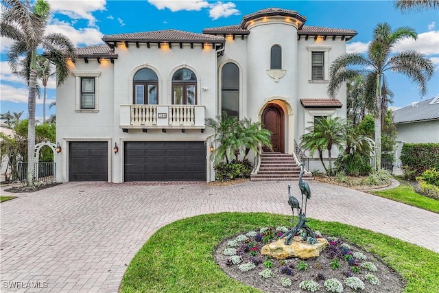 mediterranean / spanish-style home featuring a garage