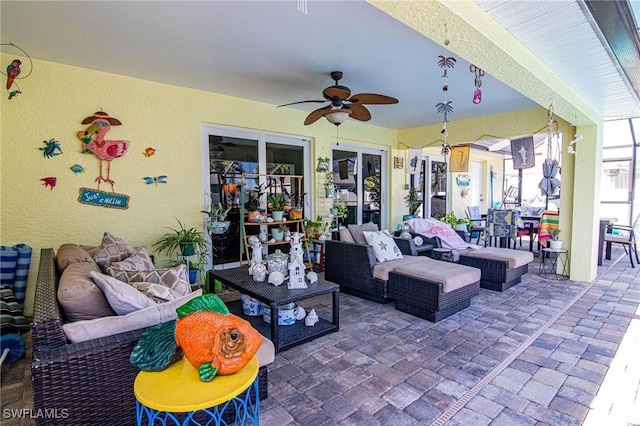 view of patio featuring ceiling fan and an outdoor hangout area