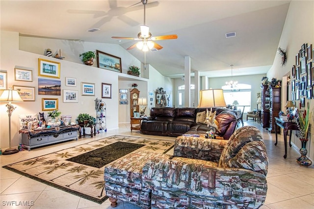 tiled living room featuring ceiling fan with notable chandelier and lofted ceiling