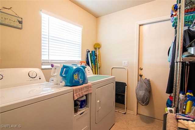 laundry area with light tile patterned floors and separate washer and dryer