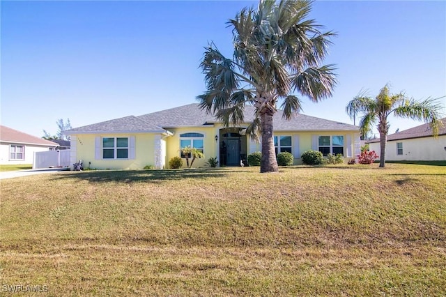 ranch-style house with a front lawn