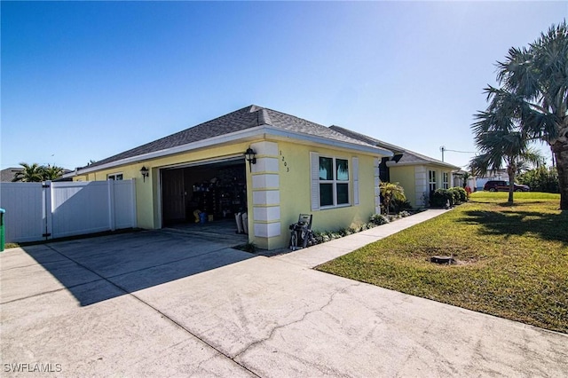 view of side of property with a lawn