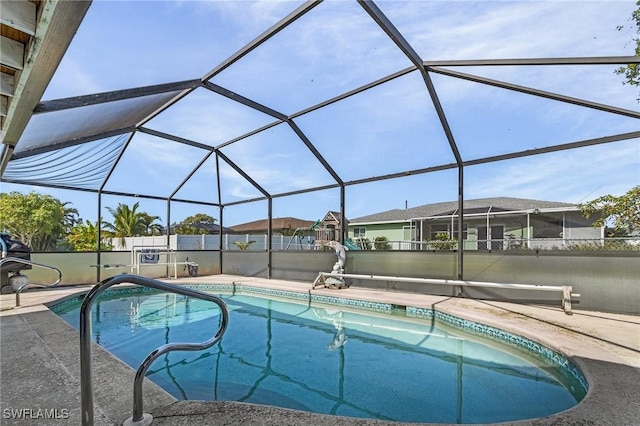 view of pool with a lanai and a patio