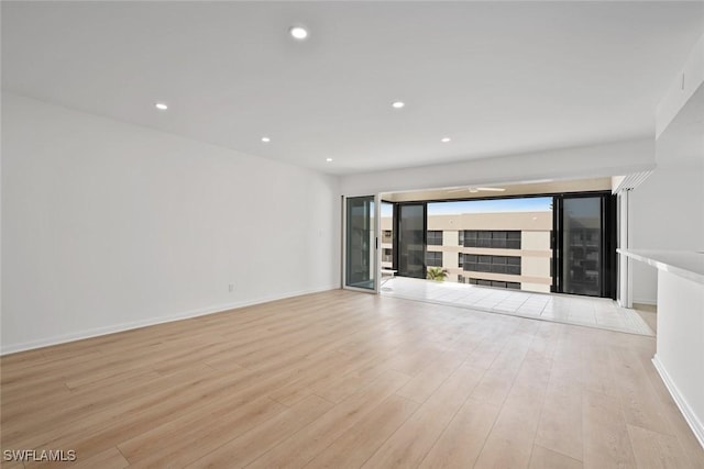 unfurnished living room featuring light wood-type flooring