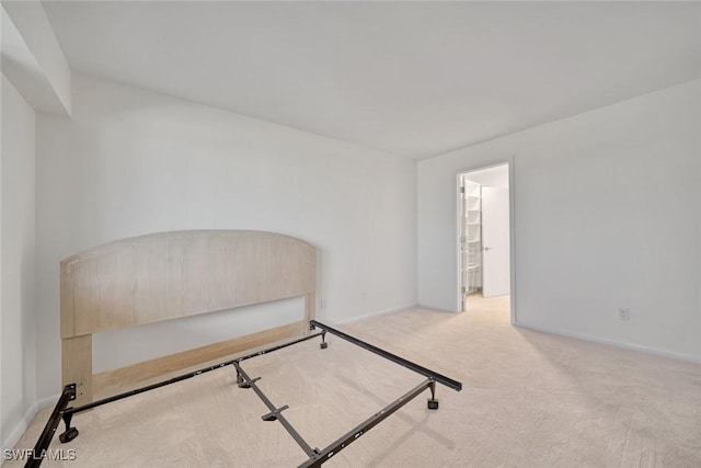 carpeted bedroom with ensuite bathroom