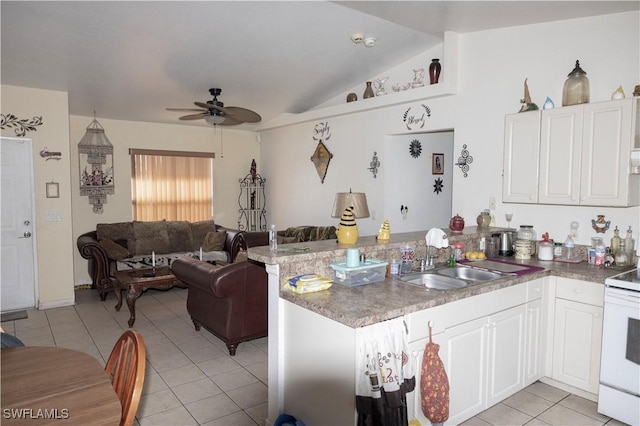 kitchen featuring sink, white cabinetry, ceiling fan, light tile patterned flooring, and kitchen peninsula