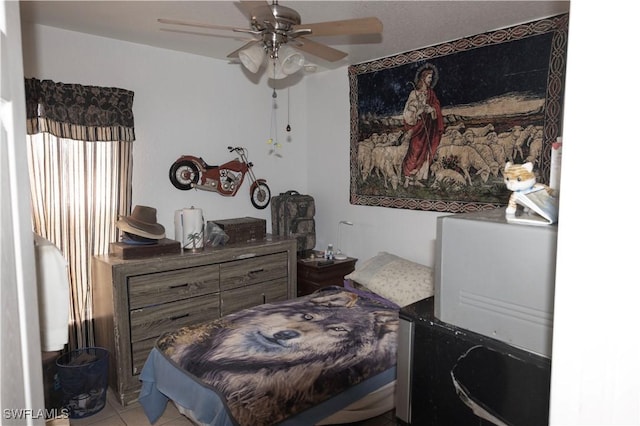 bedroom with light tile patterned floors and ceiling fan