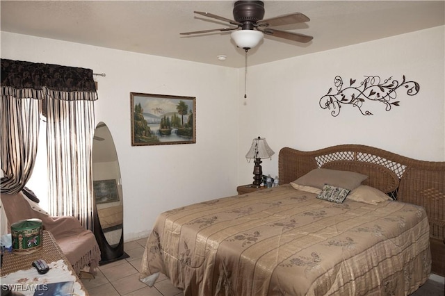 bedroom featuring light tile patterned floors and ceiling fan