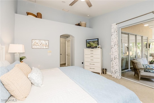 bedroom with ceiling fan, access to exterior, and light colored carpet