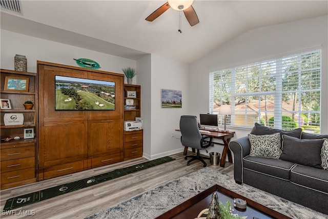 home office featuring light wood-type flooring, ceiling fan, and lofted ceiling