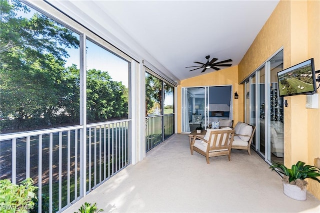 sunroom / solarium featuring ceiling fan and lofted ceiling