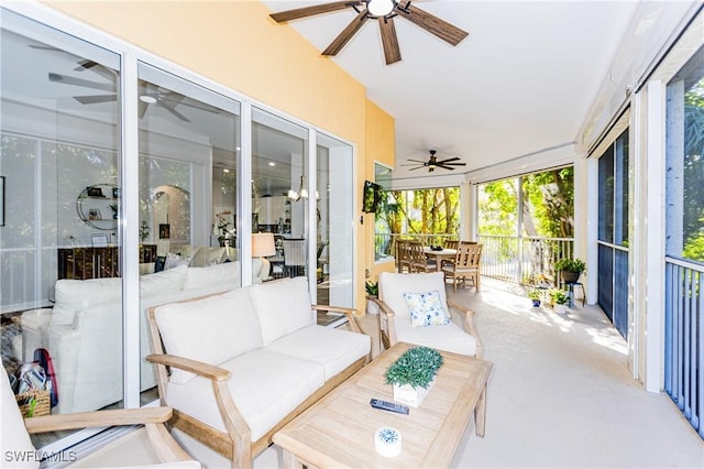 sunroom featuring ceiling fan