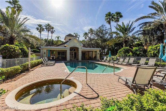 view of pool featuring a patio and a hot tub