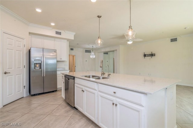 kitchen featuring stainless steel appliances, sink, white cabinetry, ceiling fan, and a center island with sink