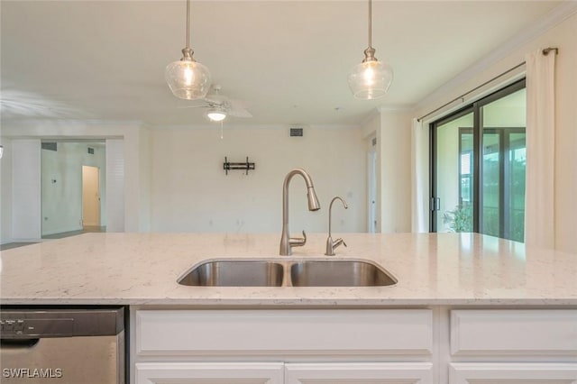 kitchen featuring sink, white cabinets, dishwashing machine, and light stone countertops