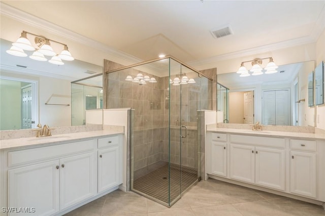 bathroom with vanity, walk in shower, tile patterned floors, and crown molding