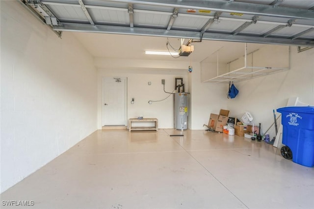 garage with a garage door opener and electric water heater