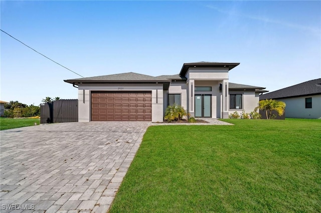 prairie-style home with a garage and a front yard