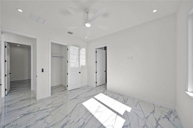 unfurnished bedroom with ceiling fan and a closet