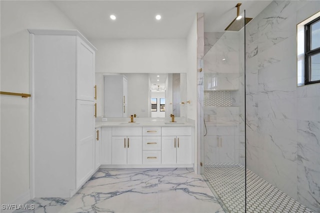 bathroom featuring vanity and a tile shower