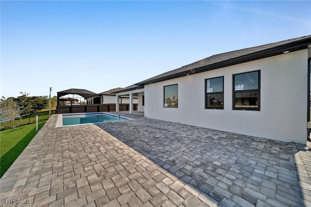 view of pool with a gazebo and a patio