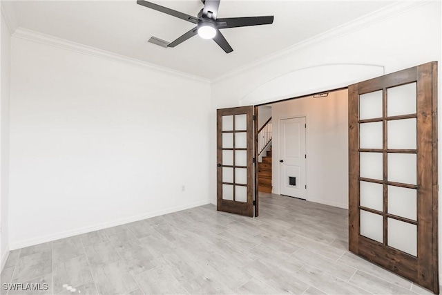 empty room featuring french doors, light wood-type flooring, ceiling fan, and crown molding