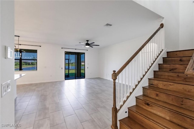 interior space featuring ceiling fan