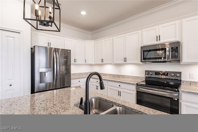 kitchen with white cabinets, crown molding, sink, and appliances with stainless steel finishes