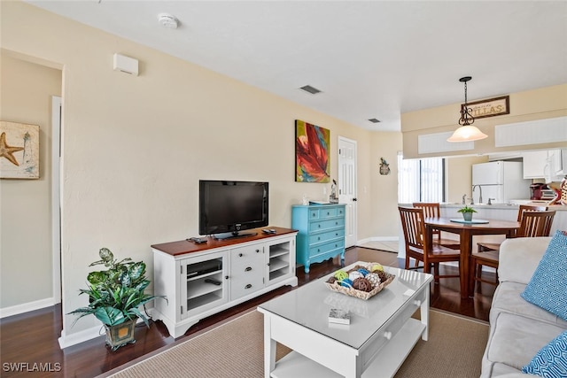 living room featuring dark hardwood / wood-style flooring