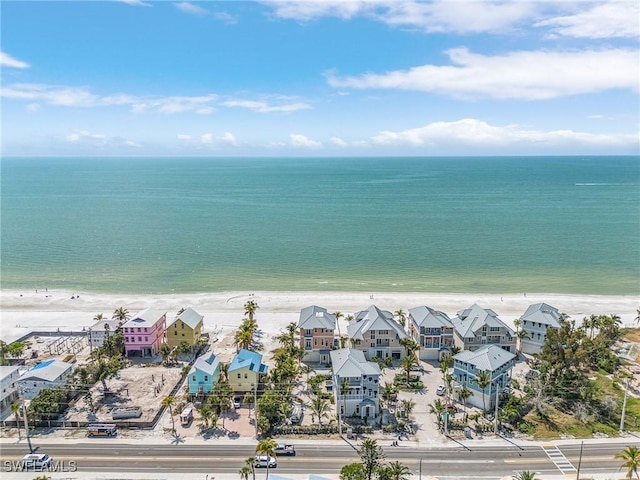 bird's eye view featuring a water view and a view of the beach