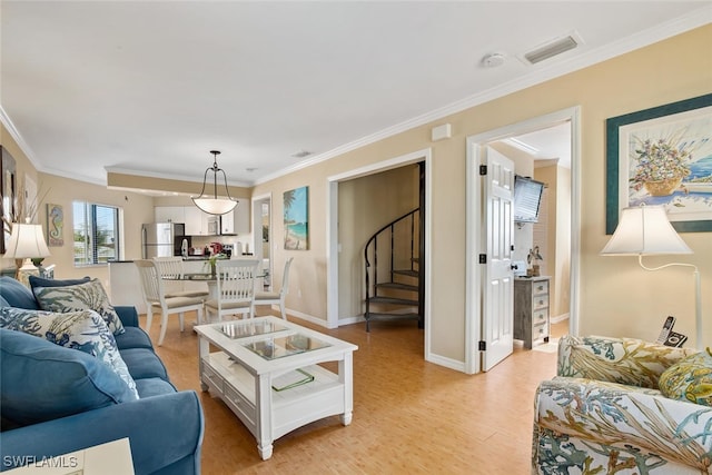 living room with crown molding and light wood-type flooring