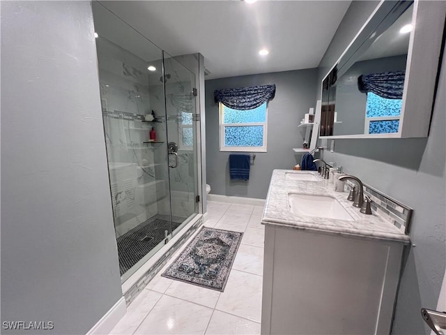 bathroom featuring vanity, an enclosed shower, and toilet