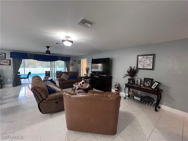 living room featuring ceiling fan and light tile patterned floors