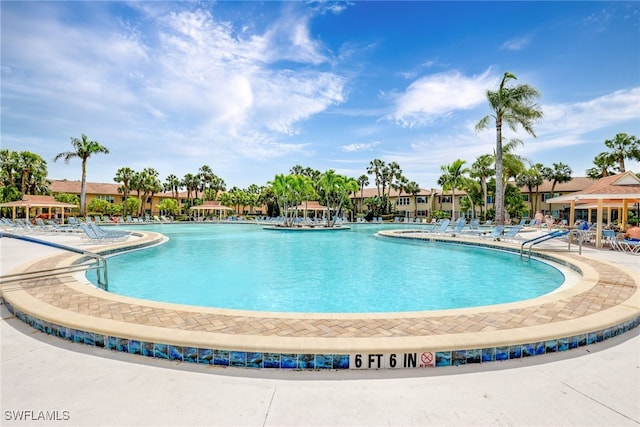 view of swimming pool with a patio area