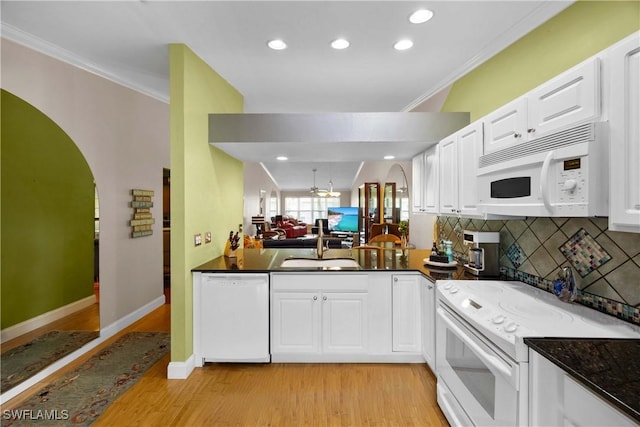 kitchen featuring white cabinetry, ceiling fan, sink, light hardwood / wood-style flooring, and white appliances