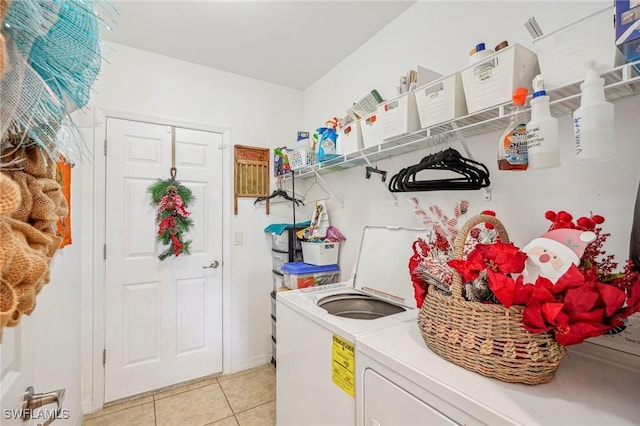 washroom with washer / clothes dryer and light tile patterned floors