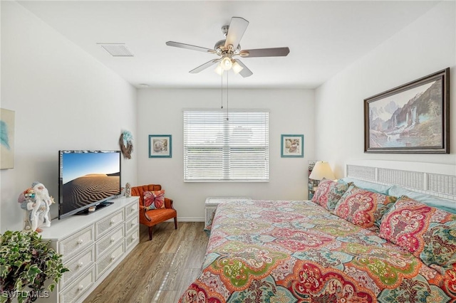 bedroom featuring ceiling fan and light hardwood / wood-style floors