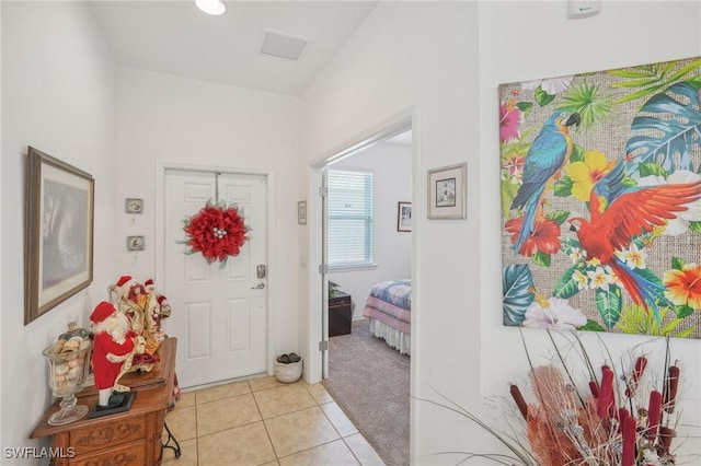 entryway featuring light tile patterned floors