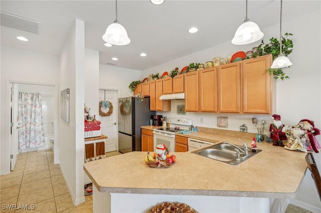 kitchen featuring white range with electric stovetop, kitchen peninsula, sink, and pendant lighting