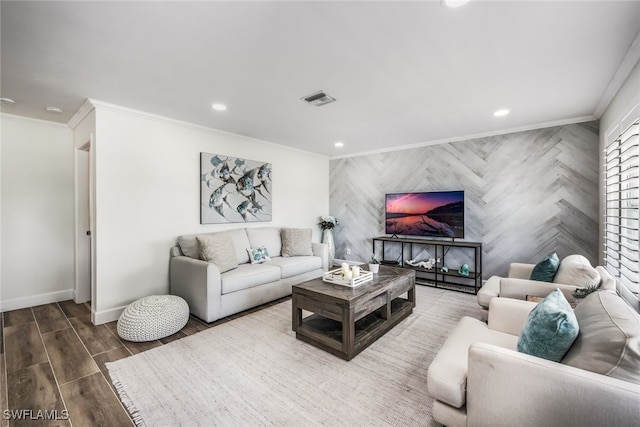 living room with hardwood / wood-style floors and crown molding